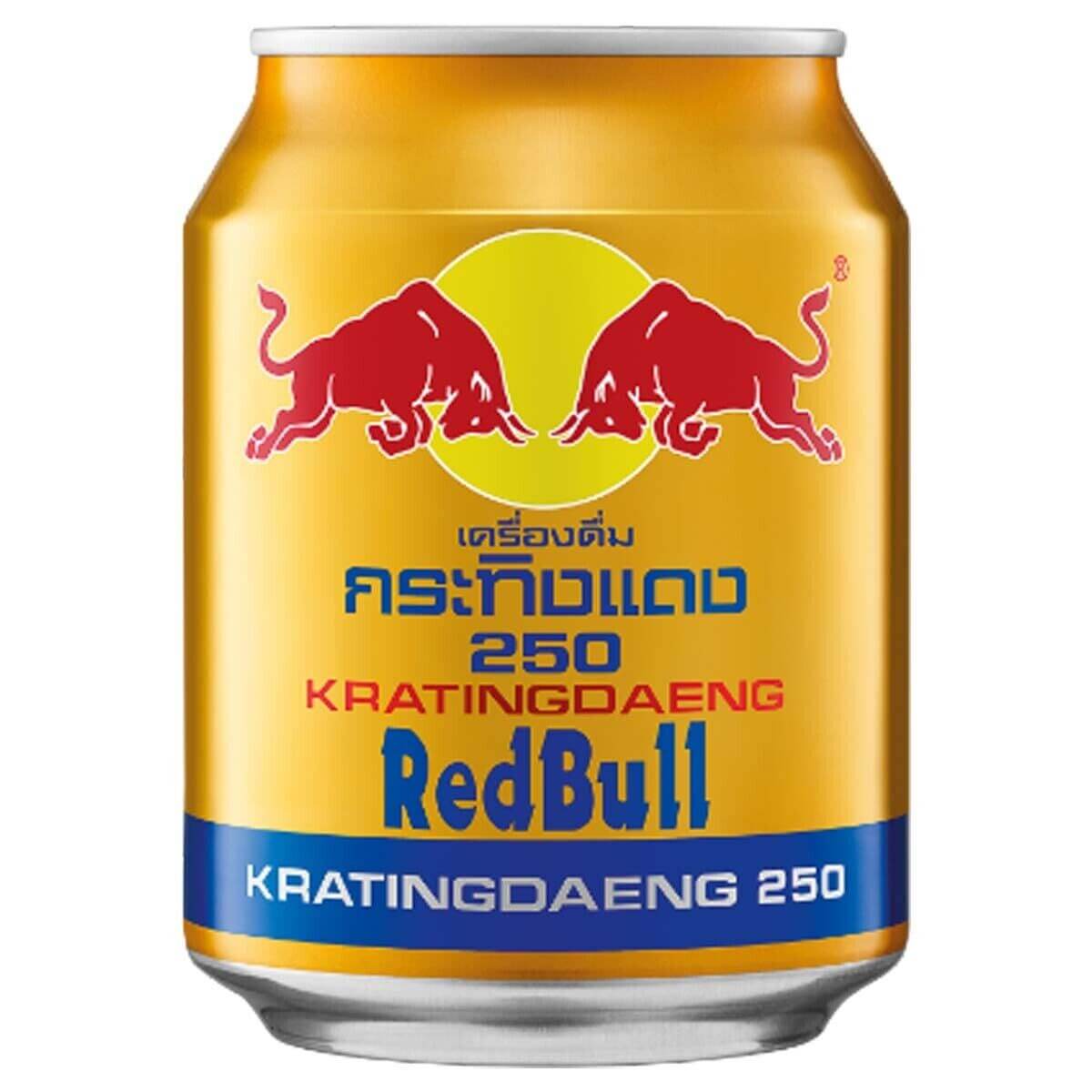 A can of Red Bull Energy Drink with a yellow label, featuring the Red Bull logo and the text 'Kratzng-Daeing 250' in Thai. A can of Red Bull Energy Drink with a yellow label, featuring the Red Bull logo and the text 'Kratzng-Daeing 250' in Thai.