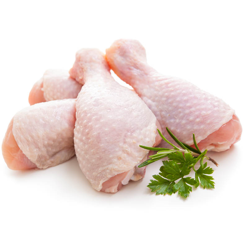A group of fresh chicken drumsticks with a sprig of parsley on a white background.