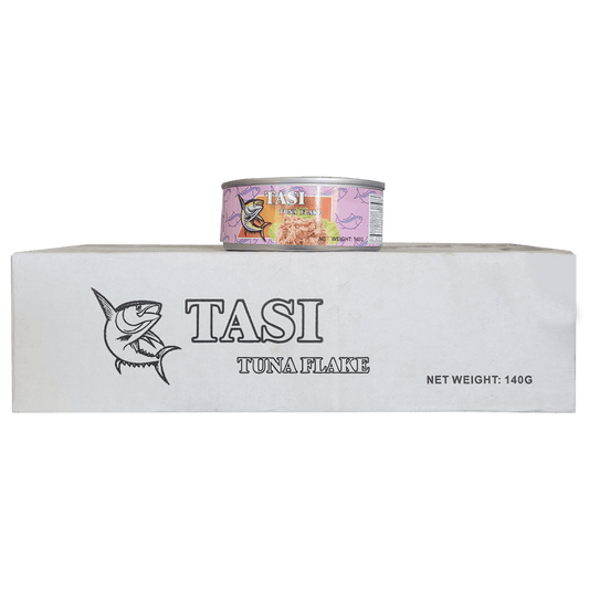 TASI tuna flake can on a white block with TASI branding
