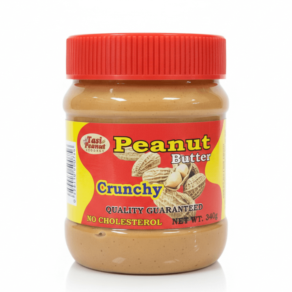 Jar of crunchy peanut butter with a red lid on a white background